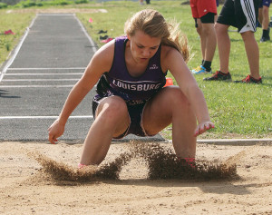 Freshman Haley Earl  lands in the pit following her attempt in the triple jump Thursday. Earl was third  in the event and fourth in the long jump.