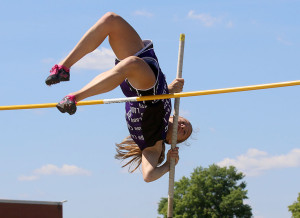 Freshman Isabelle Holtzen clears the 9-foot mark in the pole vault Thursday at the regional meet at Prairie View High School. Holtzen finished in a tie for second and qualified for state.