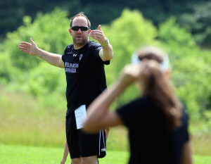 Louisburg girls soccer coach Kyle Conley gives instructions to his team Friday during the Lady Cats' team camp.