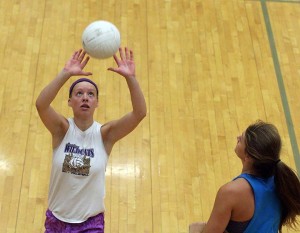 Sophomore Sophie McMullen sets up teammate Cate Stambaugh during the Lady Cats' team camp in July.