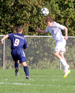 Midfielder Grant Ryals heads the ball away Tuesday during the Wildcats' home match with Eudora.