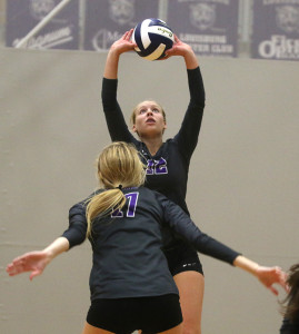 Sophomore Sophie McMullen sets up teammate Madison Turner for a kill Saturday during the Louisburg Invitational.