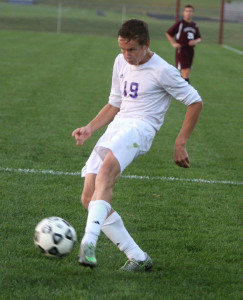 Christian Scholtz sends his game-winning goal into the back of the net Monday in Louisburg.