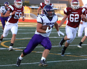 Running back Alex Dunn looks for some extra yards in the first half against Eudora on Friday.