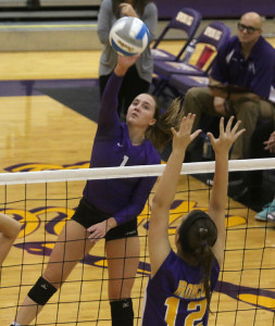 Lauren Dunn goes up for a kill Saturday in the Lady Cats' first match against Spring Hill. 
