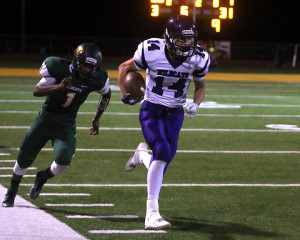 Senior receiver Mitchell McLellan runs down the sideline for a 68-yard touchdown in the first half Friday.