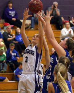 Madilyn Melton leaps for a rebound during the Lady Cats'  Nov. 23 game against Wheatridge.