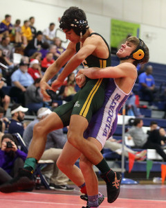 Junior Nathan Keegan lifts an opponent during a 120-pound match Saturday at the Eudora Tournament of Champions.