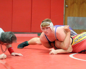 Junior Mason Koechner works for a pin during one of his five victories Saturday in Tonganoxie.