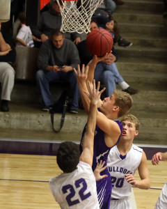Sophomore Ben Minster goes up for two points during the Wildcats' game with Baldwin on Friday at Baldwin High School.