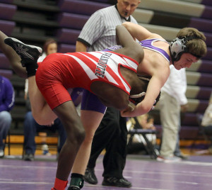 Thad Hendrix tries to throw his opponent from Wyandotte on Saturday during the 113-pound match.