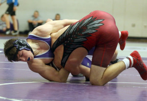 Freshman Austin Moore works for some back points during the fifth-place match at 160 pounds.
