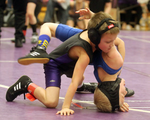 Bo Ballard tries to put an opponent on his back Saturday during a match at the Louisburg Wildcat Classic at Louisburg High School.
