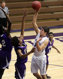 Sophomore Dalton Ribordy puts up a shot over a Harmon defender on Jan. 20 in Baldwin. 