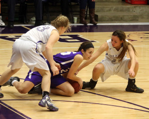 Senior Megan Roy gets on the floor for a loose ball during Friday's contest with Baldwin at Baldwin High School.