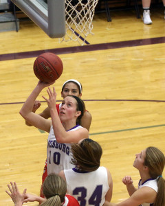 Senior Megan Lemke goes up for a shot during Tuesday' contest against Ottawa in Louisburg.