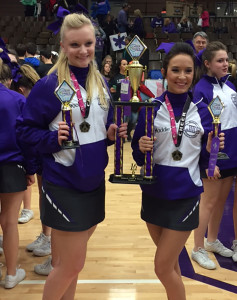 LHS seniors Brooklyn Southard (left) and Maddie Holloway pose with the team trophy and medals following Saturday's competition. 
