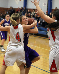 Sophomore Isabelle Holtzen gets fouled while going up for a shot Friday in Wellsville. 
