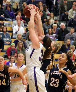 Louisburg junior Emalee Overbay leaps for a rebound during Friday's homecoming game against Eudora.