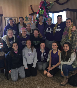 The LHS girls basketball team poses together after they helped decorate Louisburg Healthcare and Rehab for Christmas in December. 