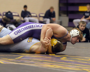 Mason Koechner pins his opponent from Spring Hill on Saturday. 