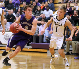 Louisburg senior Jacob Welsh drives past Paola's Blain Ohlmeier during Friday's substate game in Louisburg.