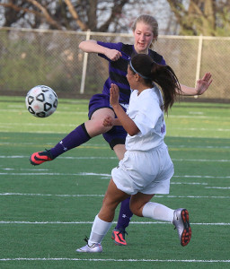 Junior Bryn O'Meara knocks the ball away from a Harmon player.