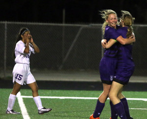 Louisburg sophomore Bailey Belcher celebrates her goal late in the second half Tuesday against Harmon.