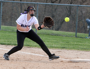 Second baseman Paige Shaffer covers first base for an out during the Lady Cats doubleheader with Paola on Thursday at Lewis-Young Park.