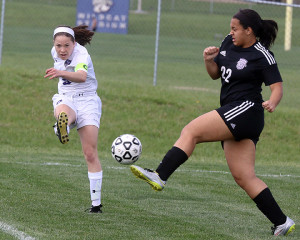 Senior Rylee Bergh clears a ball out of the back during the first half of Tuesday's home contest with Piper. 