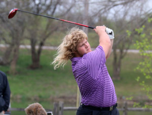 Senior Anders Vance tees off Tuesday during the Osawatomie Invitational. 