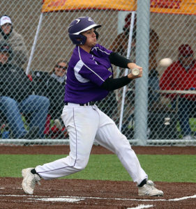 Senior Cale Schneider connects on an RBI single during the Wildcats' regional tournament game on May 17 in Paola.
