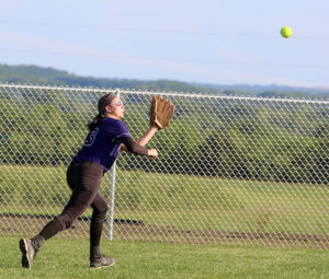 Louisburg senior Miranda White runs down a fly ball during the Lady Cats' regional game last Wednesday in Paola.