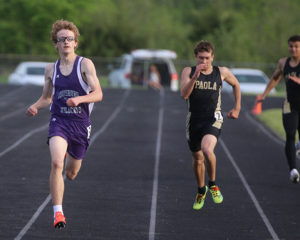 Freshman Chris Williams races down the track in the final stretch of the 400-meter dash Friday at the Redbud Relays in Wellsville.