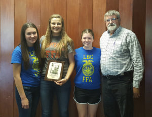(From left) Madelynn Yalowitz, Morgan Strumillo and Lexie Reece won the state Floriculture CDE. Pictured with the group is adviser Jim Morgan. Not pictured is Bryn O'Meara.