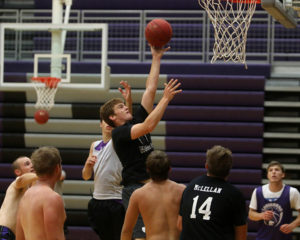 Grant Harding drives the lane for a shot during the team's final day of camp on July 15.