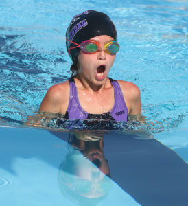 Rachel Minor takes a deep breath during her race in the 25-meter breaststroke. 