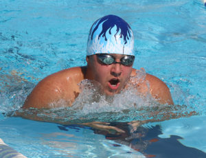 Christopher Tyson eyes the finish in the 50-meter breaststroke for the 15-and-over boys.