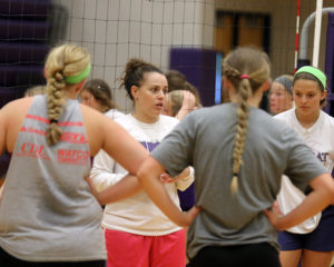 Louisburg head coach Jessica Compliment talks to her players during the final day of the Lady Cat team camp July 13.