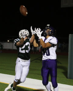Desmond Doles hauls in the Wildcats' final touchdown to seal the win Friday in De Soto.