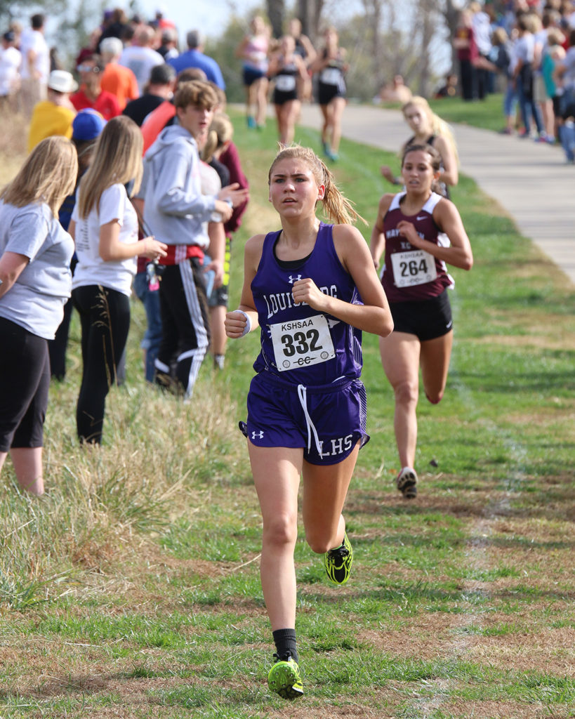 Trinity Moore leads a pack of runners toward the finish line Saturday at the Class 4A state cross country meet.