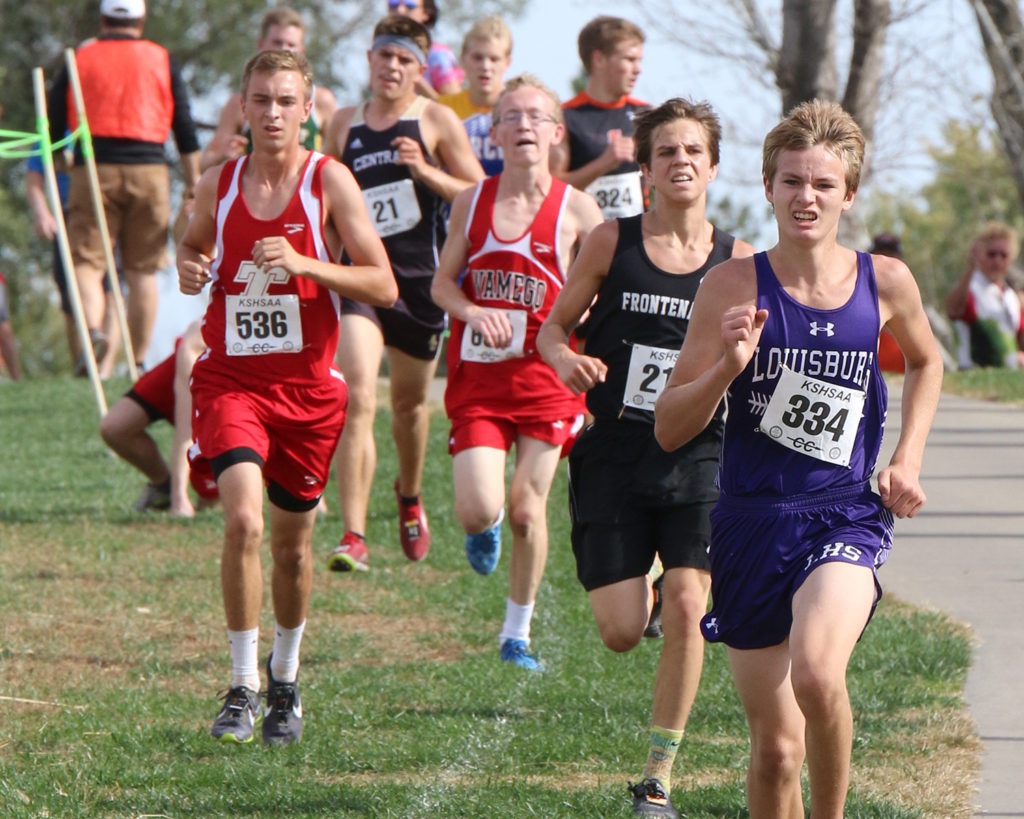 Junior Tim Smith (right) picks up the pace for final leg of the race at the Wamego Country Club.
